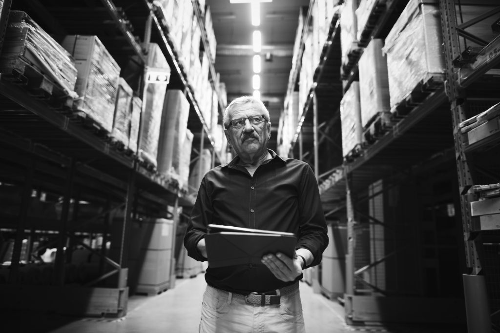 man checking stock inventory